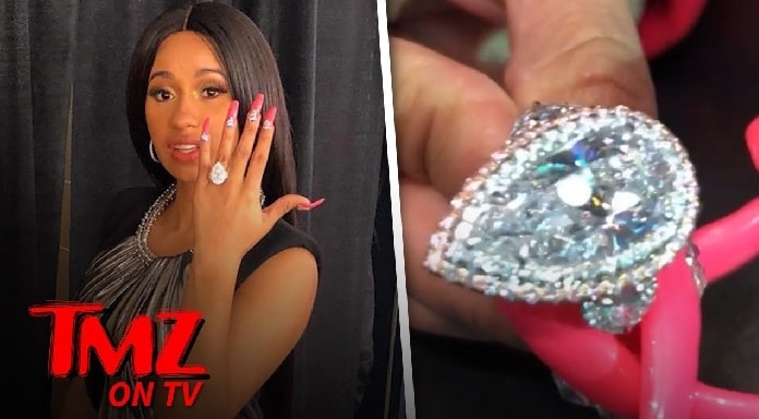 Cardi B showing her hand wearing diamond engagement ring 